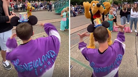 Incredibly talented kid dances with Pluto at Disneyland