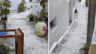 Flooding in Greece flows down stairs like an urban waterslide