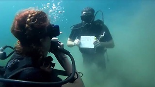 Surprise underwater marriage proposal