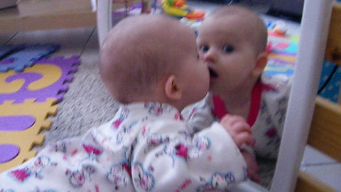 Baby Crawls To Mirror, Embraces Her Reflection