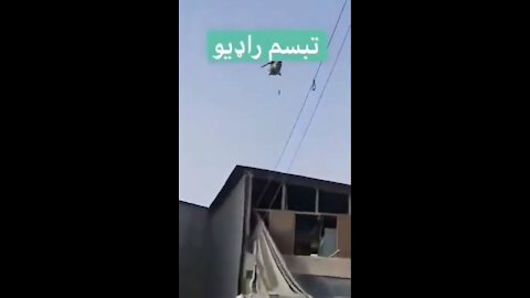 🚨RAW FOOTAGE🚨 Taliban flying Blackhawk with Taliban man hanging from it “patrolling” Kandahar