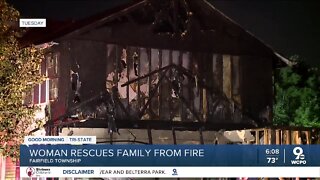 Woman rescues family from fire
