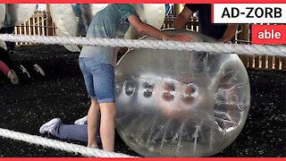 Man too fat to stand-up in big inflatable Zorbing ball