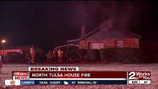 Firefighters battle house fire in North Tulsa