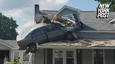 Car crashes into second floor of Pennsylvania home, left dangling from roof in 'intentional act'