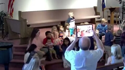 Unhappy Toddler Runs Away From Robin Lane After Pastor Ryder Takes Photo On iPad in SDA Church