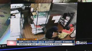 Employees fight back against armed robbers