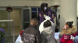 Lamar Jackson helps distribute toys to more than 150 families and children