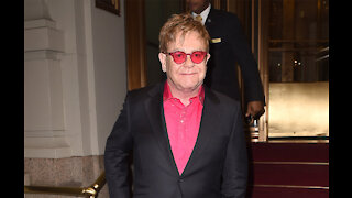 Chris Martin makes risqué joke about Sir Elton John and his husband
