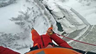 Incredible jump off a frozen dam in the French Alps