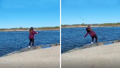 Wife hilariously 'throws herself' in the lake while fishing