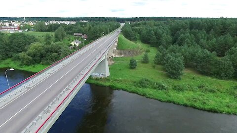Flight Along The Bridge Through River - drone camera