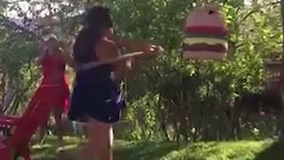 Girl Fails To Hit Hamburger Pinata