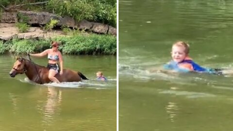 Horse pulls kid through water by his tail