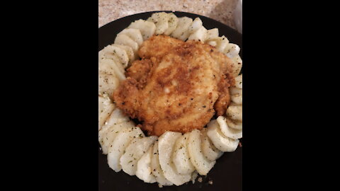 breaded chicken breast with dressed potatoe