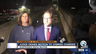 Judge won't dismiss suspended mayor's charges