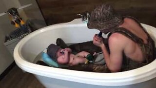 Baby can't stop giggling at his quacking dad!