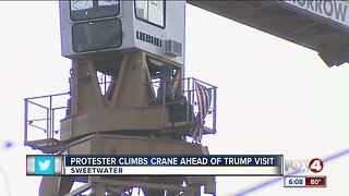 Protester climbs crane