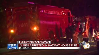 Two men arrested in hazmat house fire