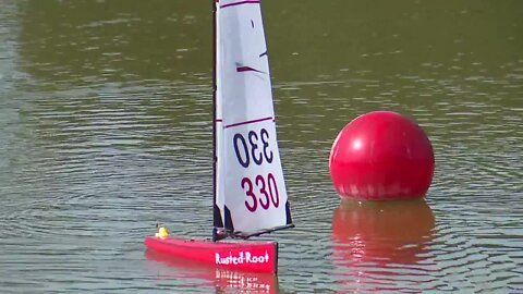 Sailors race RC sailboats at Freedom Lake Park