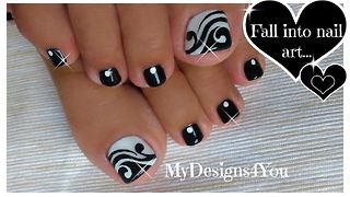 Hand painted black and white toenail art design