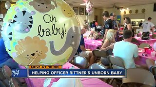 Community baby shower benefits fallen officer's wife