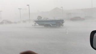 VIDEO: Strong winds push boat across parking lot