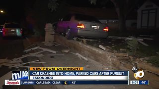 Car hits parked cars, slams into fence in Escondido
