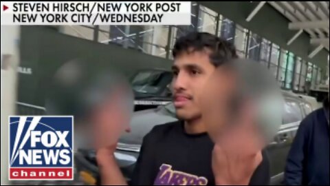 Illegal migrants in violent NYPD attack give middle finger after release