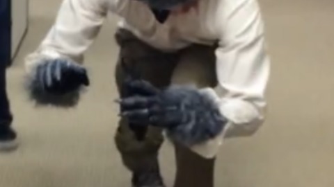 A Guy in a Werewolf Costume Scares a Coworker