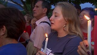 Hundreds hold vigil at NRA headquarters for shooting victims