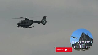 Guardia Civil Helicopter flies past Levante Beach in La Linea, Spain