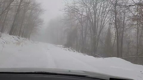 1996 JDM Subaru Alcyone SVX climbing a mountain in the snow