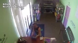 Man takes tablet from pet store
