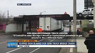 Truck driver loses job after getting stuck under Bay View bridge, blames clearance sign