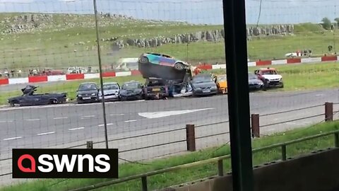 Shocking footage shows charity car jump gone wrong with vehicle slamming into group of cars