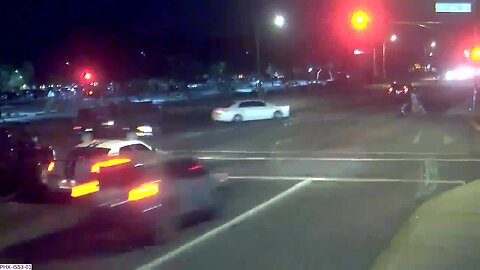 Red-light runner nearly hits family pushing stroller