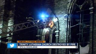 Overnight fire flares up again at Trinity Evangelical Lutheran Church