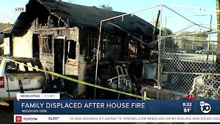 Neighbors pulled bars off window to save family from house fire