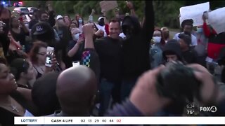 Images of officers standing with demonstrators in peaceful protest emerge across the country