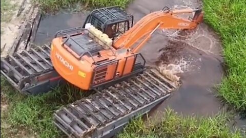 beko heavy equipment amphibious excavator hitachi ZX 210 F 5G semi long arm descends into river cana