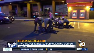Two people arrested for violating curfew