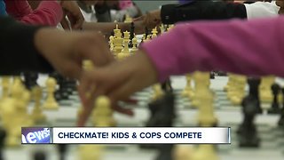 Community police using chess to mentor students