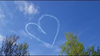 Pilot draws positive messages in sky