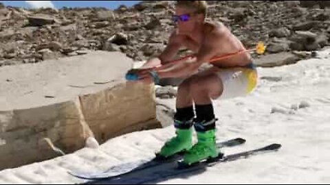 Amazing! Skier descends mountain and leaps over ice pack