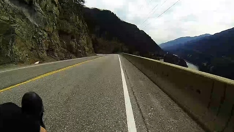 Bicyclist screams down mountain road at insane speed