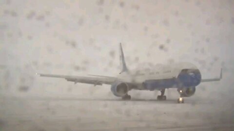 Air Force One returns to Joint Base Andrews in a snowstorm