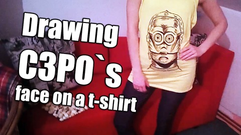 Drawing C3PO`s face on a t-shirt