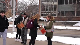 Girl Scouts donate 140 boxes of cookies to MSU students