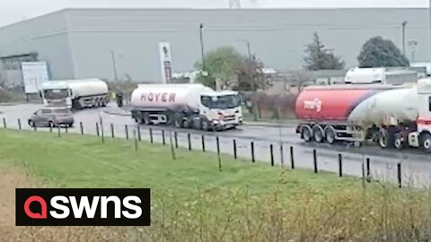 Oil tankers escort by police as protesters arrested for allegedly trying to block shipments